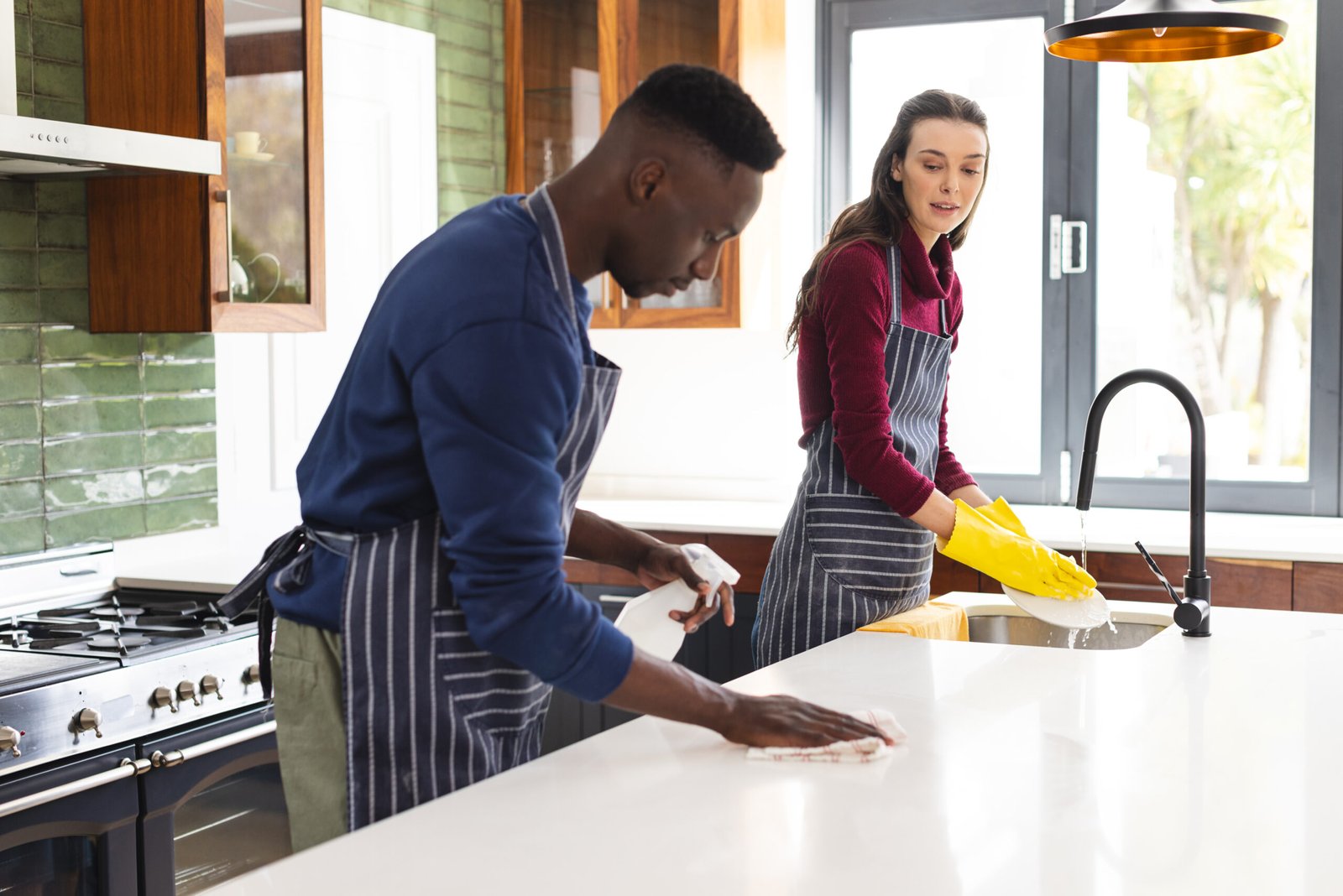 happy diverse couple cleaning countertop and doing 2025 04 04 22 19 40 utc scaled