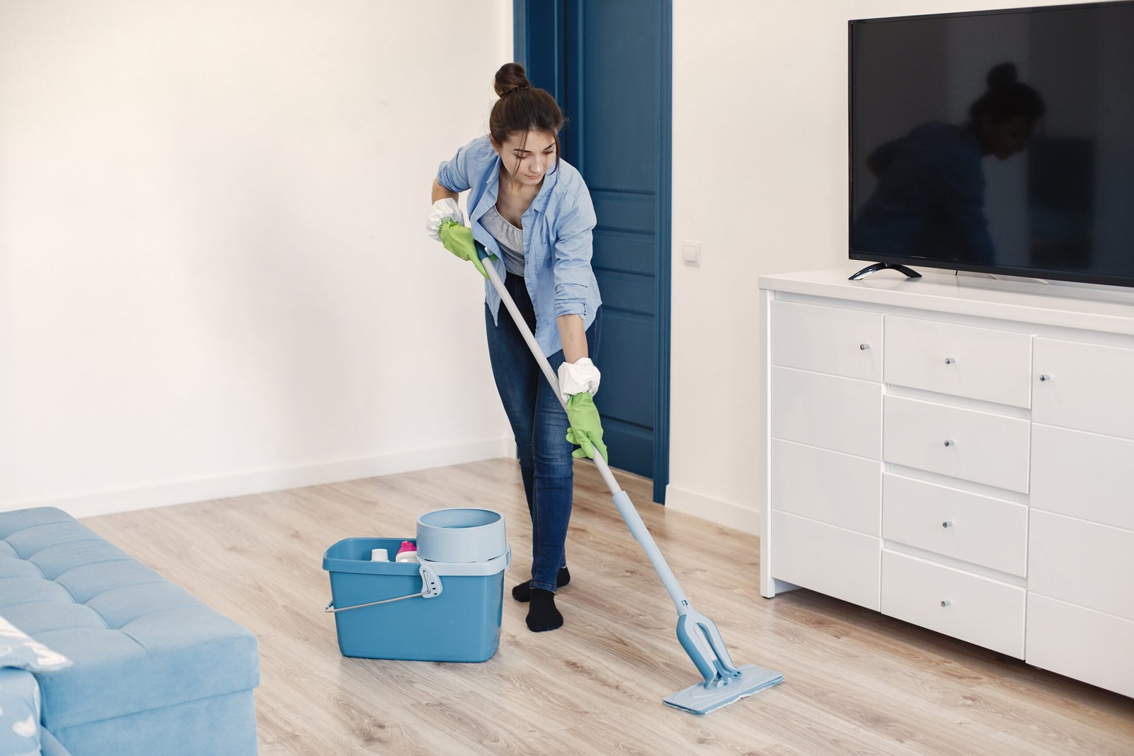 housewife woking home lady blue shirt woman clean floor scaled